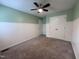 Bedroom featuring carpet, ceiling fan, and wainscoting at 419 Jera Dr, Garner, NC 27529