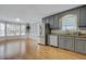 Bright dining area with large windows, wainscoting, hardwood floors and plenty of natural light at 419 Jera Dr, Garner, NC 27529