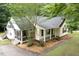 Charming exterior featuring a screened porch and a well-manicured lawn at 419 Jera Dr, Garner, NC 27529