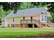 Back exterior featuring a wood deck and stairs leading to the yard at 419 Jera Dr, Garner, NC 27529