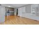Well-lit kitchen with stainless steel appliances, gray cabinets, hardwood floors and access to the backyard at 419 Jera Dr, Garner, NC 27529