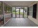 Inviting screened porch with view of the backyard and black railings at 419 Jera Dr, Garner, NC 27529
