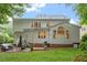 The back exterior features a patio area for relaxing and enjoying the outdoors at 4329 Hawksong Pl, Cary, NC 27518