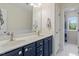 Bathroom with a dual sink vanity and a separate door to the toilet and shower area at 4329 Hawksong Pl, Cary, NC 27518