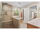 Bathroom featuring tiled walk-in shower with bench and granite sink counters at 4329 Hawksong Pl, Cary, NC 27518