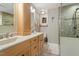 Modern bathroom featuring double sink vanity, granite counters, and glass shower at 4329 Hawksong Pl, Cary, NC 27518