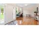 Inviting foyer features hardwood floors, a stylish rug, and an adjacent office space with ample natural light at 4329 Hawksong Pl, Cary, NC 27518