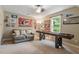 Game room with sports decor, shuffleboard table, love seat, window, and carpeted floors at 4329 Hawksong Pl, Cary, NC 27518