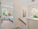 Hallway with view to a bedroom and a staircase with wood banisters at 4329 Hawksong Pl, Cary, NC 27518