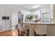 Kitchen area with granite countertops, stainless steel appliances, breakfast bar, and white cabinetry at 4329 Hawksong Pl, Cary, NC 27518