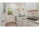 Well-equipped laundry room featuring modern washer and dryer units at 4329 Hawksong Pl, Cary, NC 27518