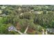 Aerial view of a wooded neighborhood featuring many beautiful homes at 4416 Thistlehill Ct, Raleigh, NC 27616