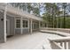 Expansive back deck with built-in seating, offering a serene outdoor space surrounded by mature trees at 4416 Thistlehill Ct, Raleigh, NC 27616
