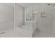 Modern bathroom featuring a luxurious bathtub, separate shower, and contemporary fixtures at 4416 Thistlehill Ct, Raleigh, NC 27616