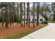 Beautiful home with mature trees providing shade and privacy, set back from the road with a long driveway at 4416 Thistlehill Ct, Raleigh, NC 27616