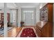 Bright foyer with hardwood floors, decorative rug and traditional furnishings at 4416 Thistlehill Ct, Raleigh, NC 27616