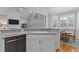 Kitchen with granite countertops and stainless steel appliances, open to the dining area at 4416 Thistlehill Ct, Raleigh, NC 27616