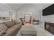 Spacious living room with a fireplace, neutral tones, and ample natural light, creating a cozy atmosphere at 4416 Thistlehill Ct, Raleigh, NC 27616