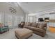 Bright living room open to the kitchen, featuring a vaulted ceiling and neutral decor at 4416 Thistlehill Ct, Raleigh, NC 27616