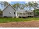 Spacious backyard featuring a large wooden deck perfect for outdoor entertaining and relaxation at 4416 Thistlehill Ct, Raleigh, NC 27616