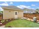 Backyard featuring artificial turf, a wood fence, and rock landscaping at 4605 All Points View Way, Raleigh, NC 27614