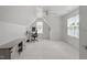 Spacious bonus room with pitched ceilings, natural light, and a desk in the corner at 4605 All Points View Way, Raleigh, NC 27614
