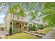 View of the charming two-story home featuring a welcoming front porch and maintained landscaping at 4605 All Points View Way, Raleigh, NC 27614