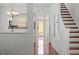 Bright hallway leading to kitchen and backyard, next to stairs to upper level at 4605 All Points View Way, Raleigh, NC 27614