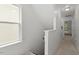 Bright hallway with window and neutral carpet leads to bedrooms at 4605 All Points View Way, Raleigh, NC 27614