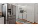 Convenient laundry closet adjacent to the stainless refrigerator at 4605 All Points View Way, Raleigh, NC 27614