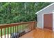 Back deck overlooking treed yard and providing additional outdoor space at 4658 Fawnbrook Cir, Raleigh, NC 27612