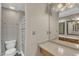 Bathroom features a large mirror over the vanity and a shower with a striped curtain at 4658 Fawnbrook Cir, Raleigh, NC 27612
