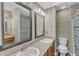 Double sink bathroom features new countertops and mirrors at 4658 Fawnbrook Cir, Raleigh, NC 27612