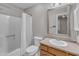 Bathroom featuring a shower-tub combo with curtain and a single sink vanity at 4658 Fawnbrook Cir, Raleigh, NC 27612
