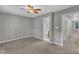 Bedroom featuring neutral carpet, a ceiling fan, and a hall to other rooms at 4658 Fawnbrook Cir, Raleigh, NC 27612