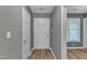 Entryway featuring durable wood-look flooring and a convenient coat rack at 4658 Fawnbrook Cir, Raleigh, NC 27612
