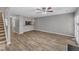 Spacious living room with luxury vinyl plank flooring and a staircase at 4658 Fawnbrook Cir, Raleigh, NC 27612