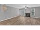 Living room offering a ceiling fan, fireplace, and French doors to the backyard at 4658 Fawnbrook Cir, Raleigh, NC 27612