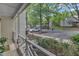 View from the porch overlooking parking and green spaces, highlighting a peaceful community at 4658 Fawnbrook Cir, Raleigh, NC 27612
