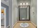 Cozy powder room featuring vanity with sink and framed mirror, complete with a stylish sconce at 4658 Fawnbrook Cir, Raleigh, NC 27612