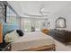 Bright primary bedroom with tray ceilings, decorative wallpaper, and ample natural light from two windows at 5 Providence Ridge Ln, Durham, NC 27713