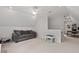 Bonus room with comfortable seating, ample natural light and versatile space for relaxation and play at 5 Providence Ridge Ln, Durham, NC 27713