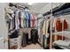 Walk-in closet with wire shelving and organized storage solutions for clothes, shoes, and accessories at 5 Providence Ridge Ln, Durham, NC 27713