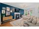 Comfortable living room with hardwood floors, a fireplace, and stylish contemporary decor at 5 Providence Ridge Ln, Durham, NC 27713