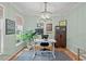 Home office with a large desk, natural light, and stylish decor at 5 Providence Ridge Ln, Durham, NC 27713