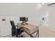 Home office setup with a modern desk, dual monitors, and comfortable seating, conducive to productivity at 5 Providence Ridge Ln, Durham, NC 27713
