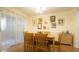 Cozy dining room with wood table, chairs, and lots of art displayed on the wall at 516 Ryan Rd, Cary, NC 27511