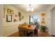 Inviting dining room with decorative wall art, wood table and chairs that is perfect for entertaining at 516 Ryan Rd, Cary, NC 27511