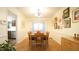 Bright dining room with a wooden table, six chairs, and a view into the adjacent room at 516 Ryan Rd, Cary, NC 27511
