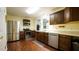 Well-equipped kitchen featuring stainless steel appliances, plenty of counter space, and wood cabinets at 516 Ryan Rd, Cary, NC 27511